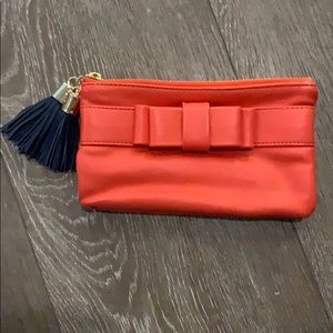 Clutch with tassel zipper
